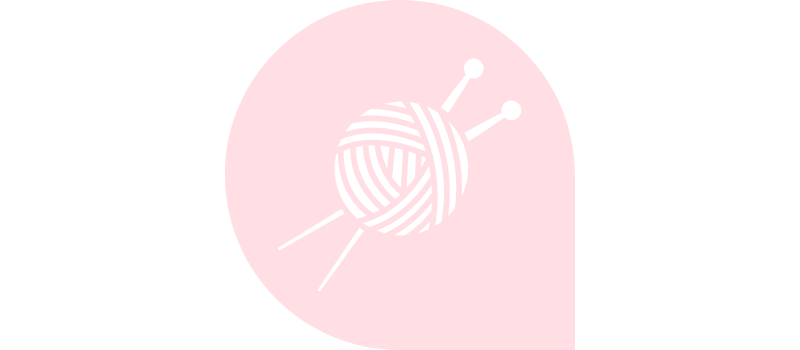 White on pale pink vector icon of knitting needles and ball of wool